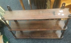 A Victorian stained pine hanging shelf. 84 cm wide; 60 cm high; 16 cm deep.