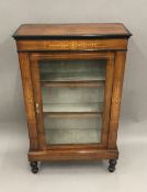 A Victorian inlaid walnut pier cabinet. 110 cm high; 68 cm wide; 29 cm deep.