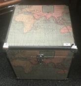 A set of trunks decorated with maps