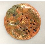 A Chinese carved agate roundel