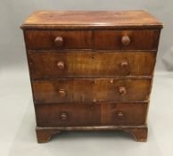 A Georgian walnut and pine country chest of drawers