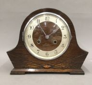 An oak mantle clock