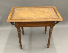 A Victorian oak writing table