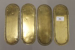 Four Victorian brass finger plates