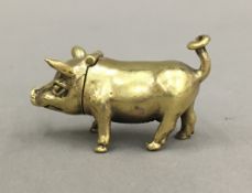 A brass vesta in the form of a pig