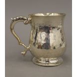 A beaten silver Christening mug (5.