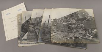 A quantity of black and white photographs depicting a train wreck,