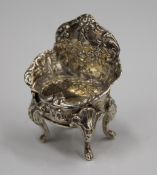 A miniature silver embossed chair