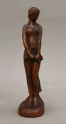 A carved wooden figure of an Art Nouveau girl