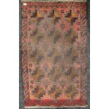 A red ground Caucasian rug