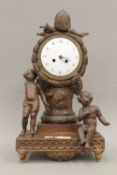 A 19th century carved wooden mantle clock