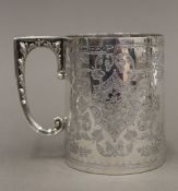 A Victorian embossed silver Christening mug (7.