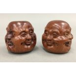 Two wooden four face Buddha heads