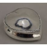 A silver heart shaped trinket box (3.