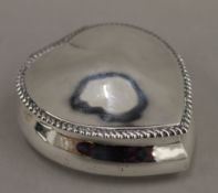 A silver heart shaped trinket box (3.