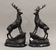 A pair of bronze stags