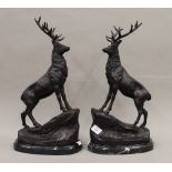 A pair of bronze stags