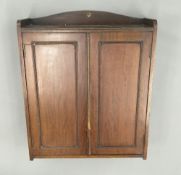 An Edwardian walnut wall hanging cabinet