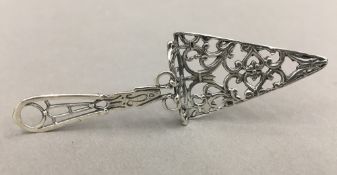 A miniature silver cake slice