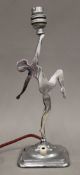 An Art Deco chrome table lamp formed as a dancing girl