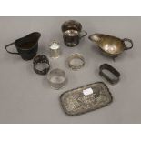 A quantity of small silver items, including a sauce boat, a cream jug, napkin rings, etc.