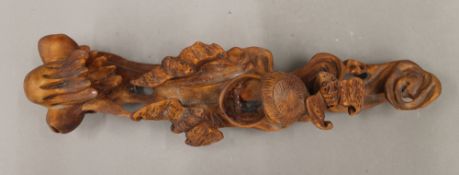 A carved wooden ruyi sceptre