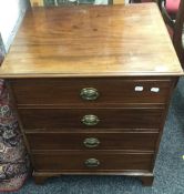 A 19th century mahogany commode chest. 73 cm high; 60.5 cm wide; 51 cm deep.