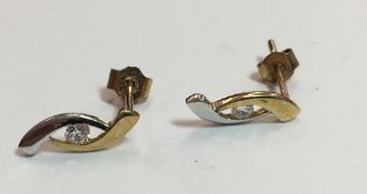 A pair of bi-colour gold earrings