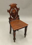 A Victorian mahogany hall chair