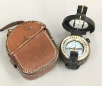 A leather cased Stanley compass