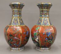 A pair of Chinese red and multi-coloured porcelain vases