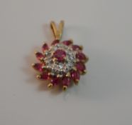 A 9 ct gold diamond and ruby pendant