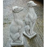 A pair of garden ornaments formed as greyhounds