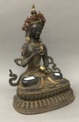 A large bronze model of Buddha decorated with stones. 46 cm high.