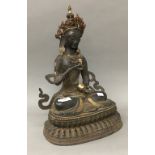 A large bronze model of Buddha decorated with stones. 46 cm high.