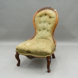 A Victorian walnut nursing chair