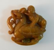 A Chinese carved agate roundel