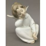 A Lladro porcelain model of an angel