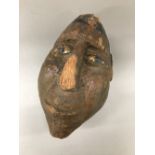A tribal carved coconut,