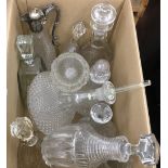 A quantity of cut glass decanters, etc.