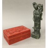 A cinnabar lacquered box and a figure of Guanyin