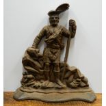 A large cast iron Highlander door stop