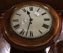 A Victorian walnut framed dial clock
