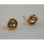 A pair of 9 ct gold stone set knot earrings