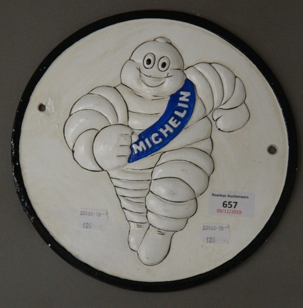 A cast iron Michelin man plaque