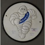 A cast iron Michelin man plaque