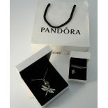 A boxed Pandora silver dragonfly pendant on chain