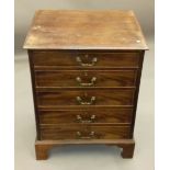 A mahogany chest of drawers and a mahogany sofa table