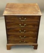 A mahogany chest of drawers and a mahogany sofa table