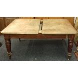 A Victorian mahogany extending dining table with two original leaves (with two further associated